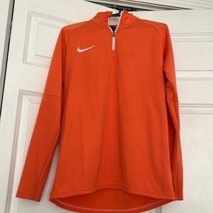Orange Nike pullover.